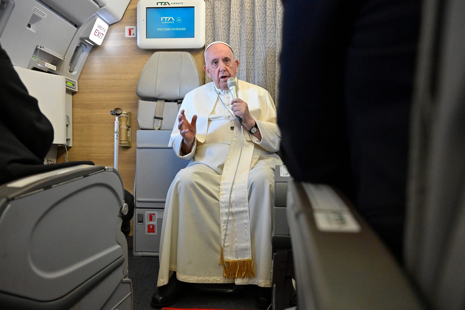 Pope Francis talking to the press on the plane